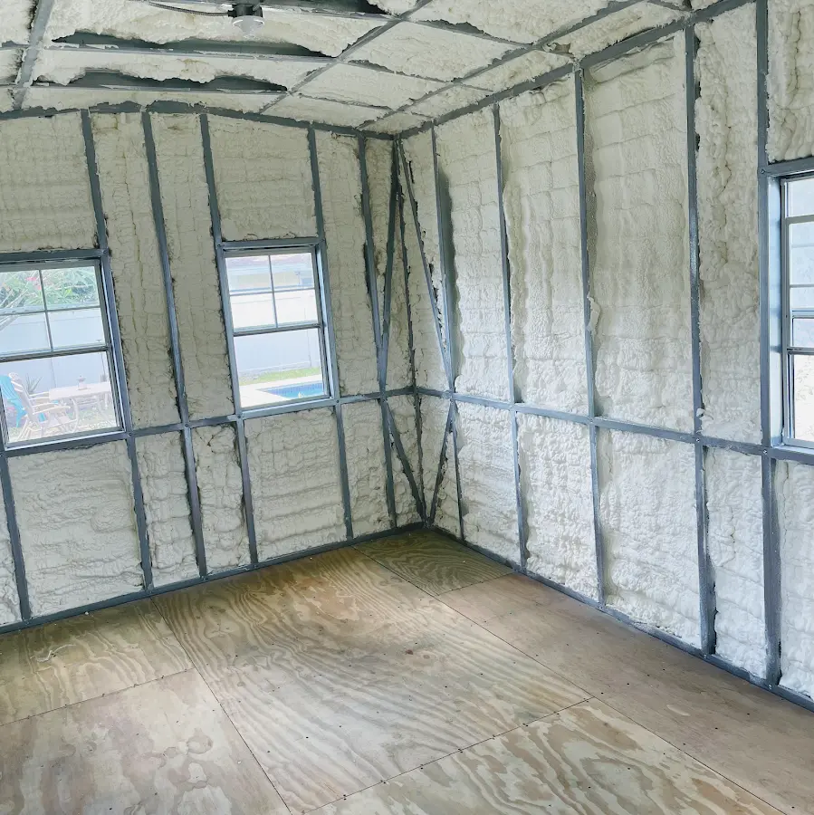 Closed-cell spray foam insulation applied to wall cavities in a residential project in Woodbury